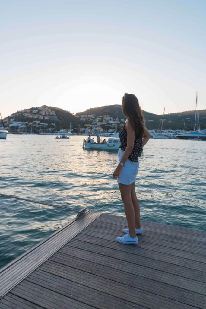 Woman gazing at sunset over water
