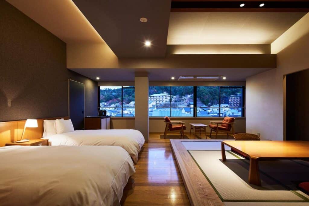 8 UNIQUE Miyajima Ryokans, Hiroshima 16 Modern room with scenic mountain view.