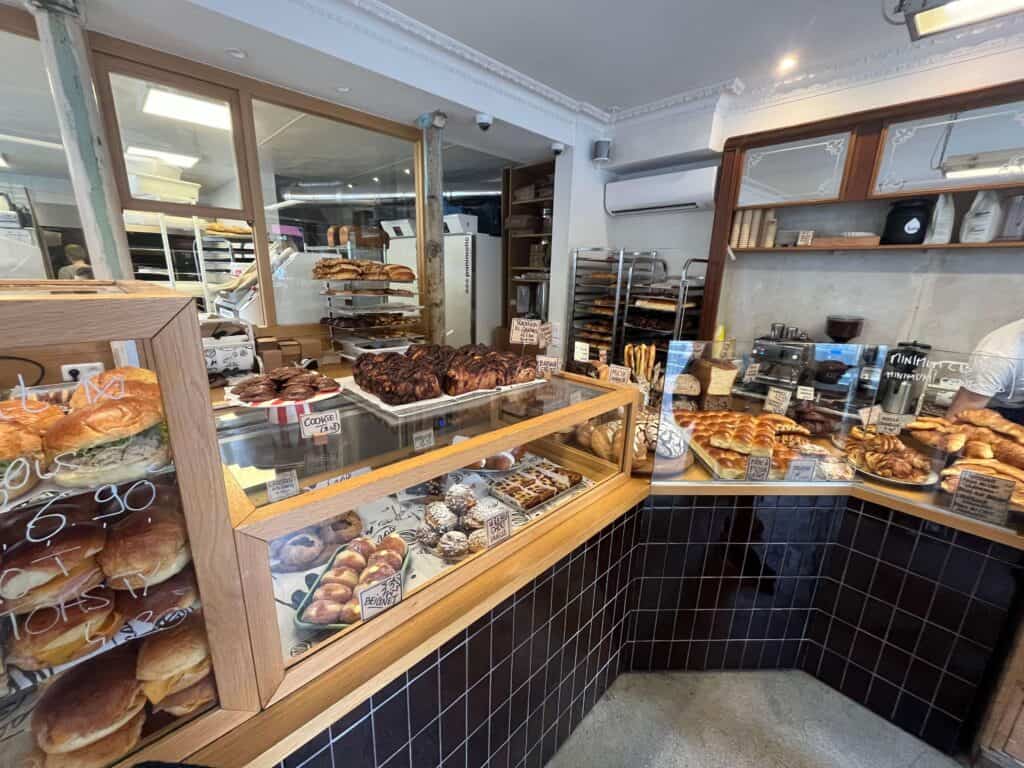 Things to Do in Paris with Teenagers 12 buying a croissant at a local patisserie in paris france
