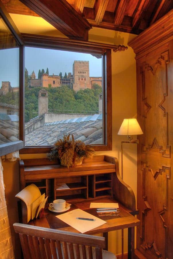 Granada in Two Days Itinerary: Local Guide 8 Cozy desk overlooking Alhambra fortress.