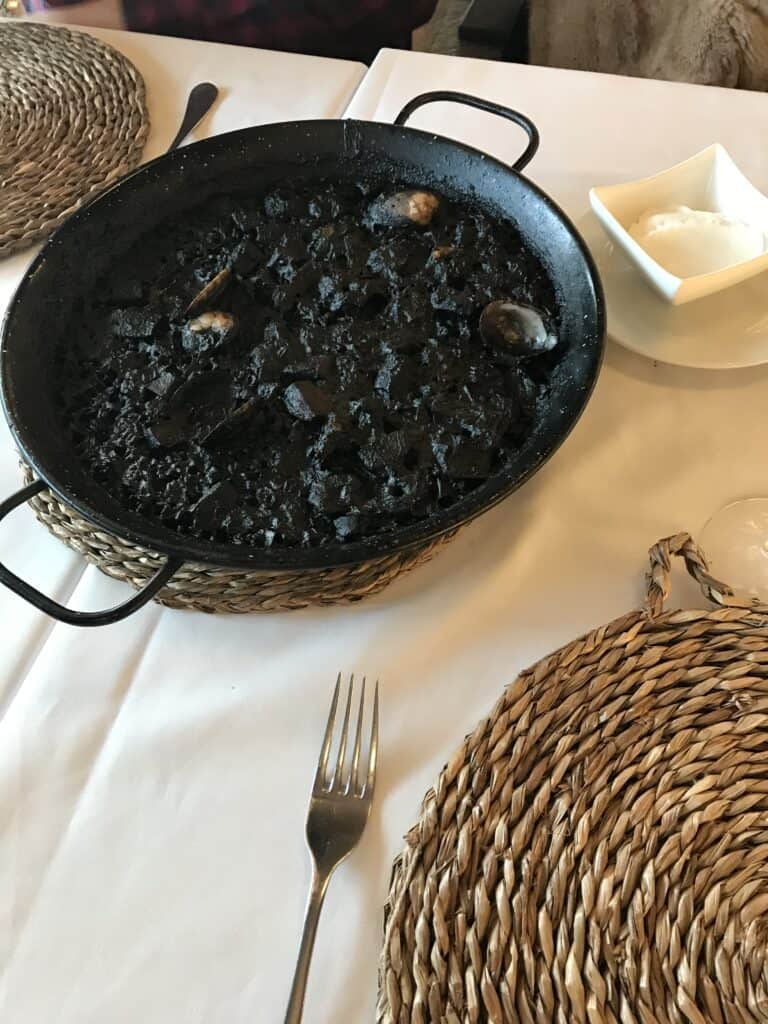 3 day itinerary in Barcelona: Local Guide 12 Black rice paella on a table