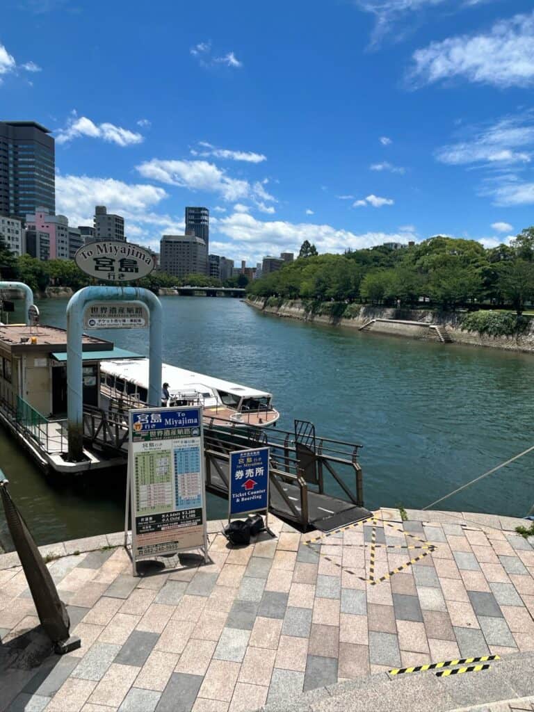 8 UNIQUE Miyajima Ryokans, Hiroshima 3 Ferry dock by a scenic river.