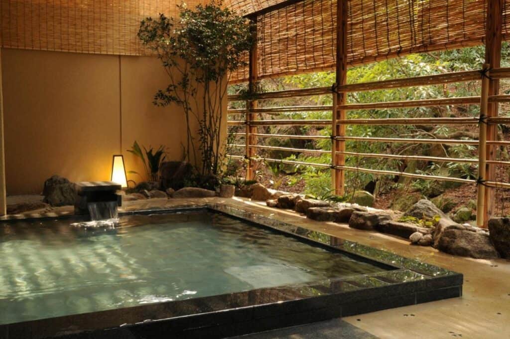 8 UNIQUE Miyajima Ryokans, Hiroshima 9 Serene indoor hot spring retreat.