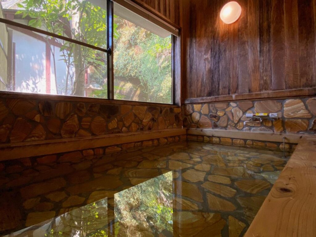 8 UNIQUE Miyajima Ryokans, Hiroshima 29 Serene indoor hot spring bath