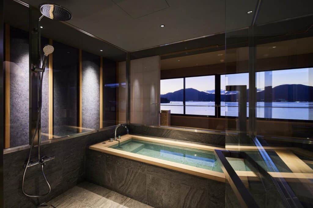 8 UNIQUE Miyajima Ryokans, Hiroshima 18 Modern onsen with scenic water view