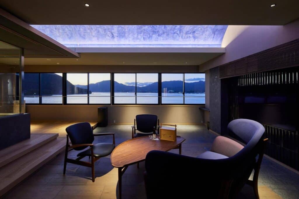8 UNIQUE Miyajima Ryokans, Hiroshima 19 Modern seating with scenic mountain view.