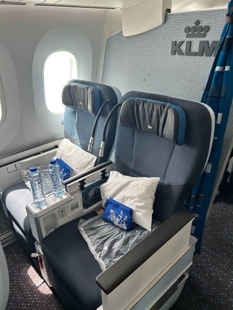 ULTIMATE 10 Day Japan Travel Itinerary 2 Irene seating in comfortable premium economy seats with amenities flying to Osaka for a 10 day Japan travel itinerary.