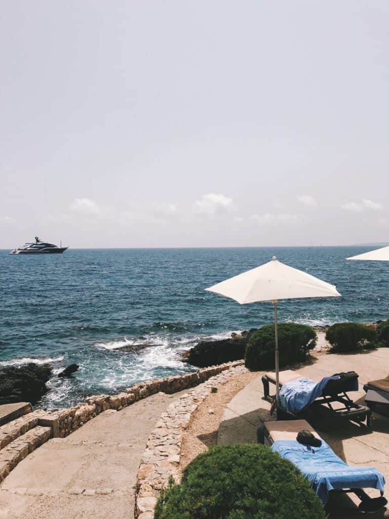 Mallorca Travel Itinerary in 4 Days 22 Coastal view with yacht and umbrellas