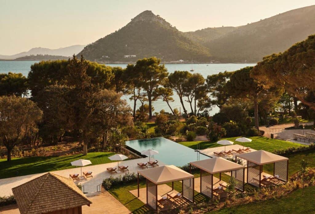 Mallorca Travel Itinerary in 4 Days 8 Serene poolside view with mountains.