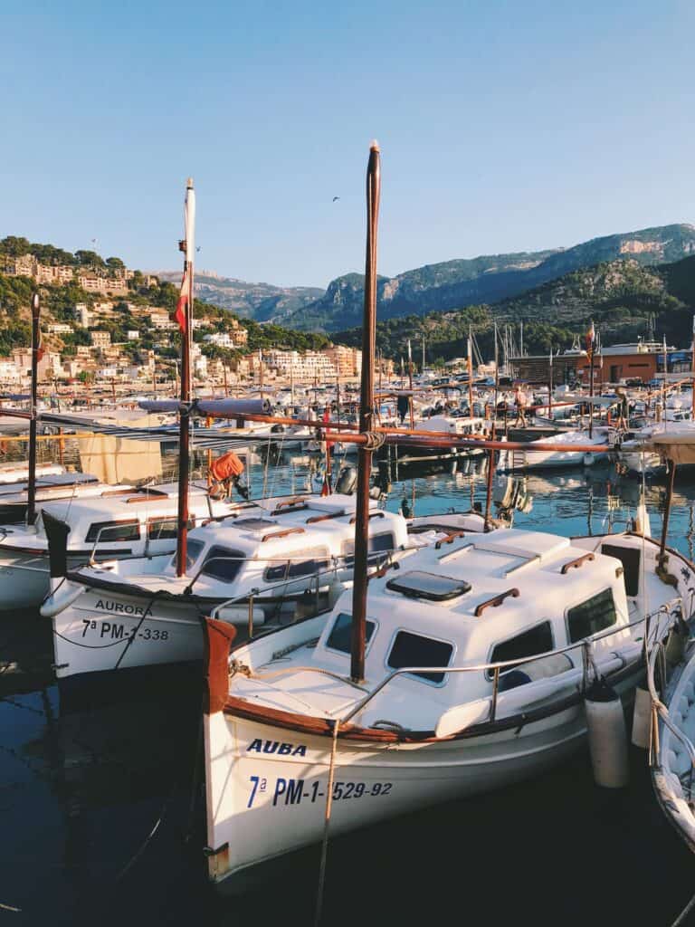 Mallorca Travel Itinerary in 4 Days 17 Boats docked in scenic Soller port.