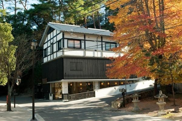 8 UNIQUE Miyajima Ryokans, Hiroshima 34 Traditional ryokan surrounded by autumn foliage.