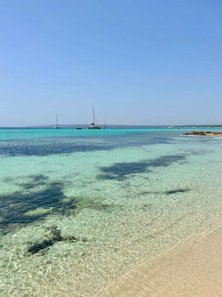 crystal clear water at migjorn beach in formentera, spain