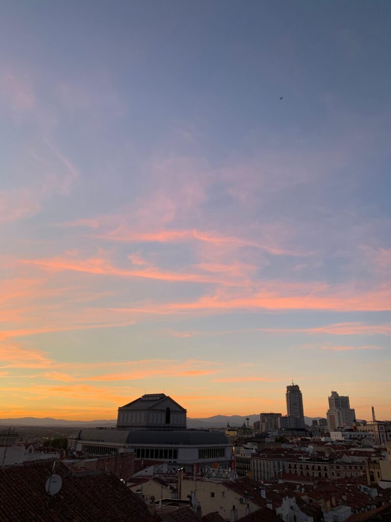 Where to Stay in Madrid: 14 Best Hotels 62 irene watching the sunset in a rooftop madrid spain