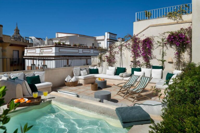 seating area and rooftop pool at casa del rey sabio hotel, one of my favorite hotels with pool in seville spain