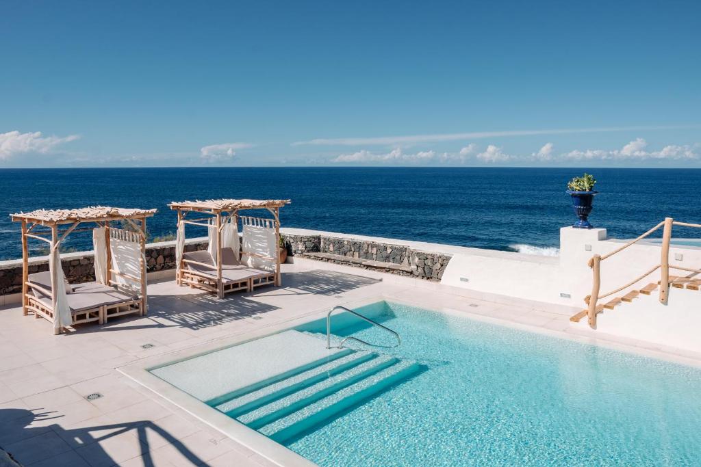 11 UNIQUE Boutique Hotels in Tenerife 1 swimming pool and views of the ocean from boutique eco hotel costa magica, one of the best boutique hotels in tenerife, spain