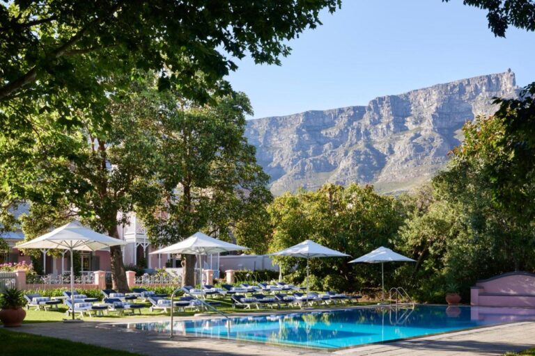 swimming pool at mount nelson belmond luxury hotel, one of the most unique places to stay in cape town, south africa