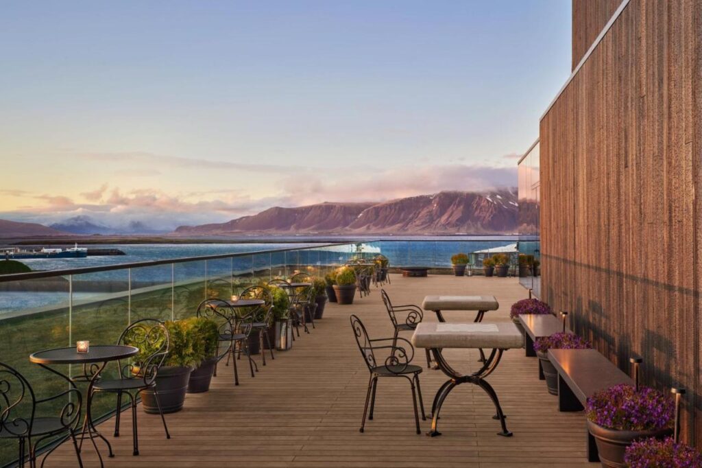 Where to Stay in Reykjavík: Top Guide 1 terrace with beautiful views at the reykjavik edition luxury hotel, a super cool hotel where to stay in reykjavik, iceland