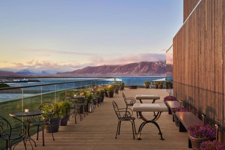 terrace with beautiful views at the reykjavik edition luxury hotel, a super cool hotel where to stay in reykjavik, iceland