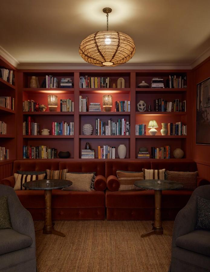 13 Unique Hotels in Barcelona, Spain 21 Cozy reading nook with bookshelves.