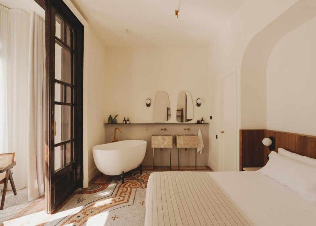 13 Unique Hotels in Barcelona, Spain 17 Elegant room with bathtub and decor