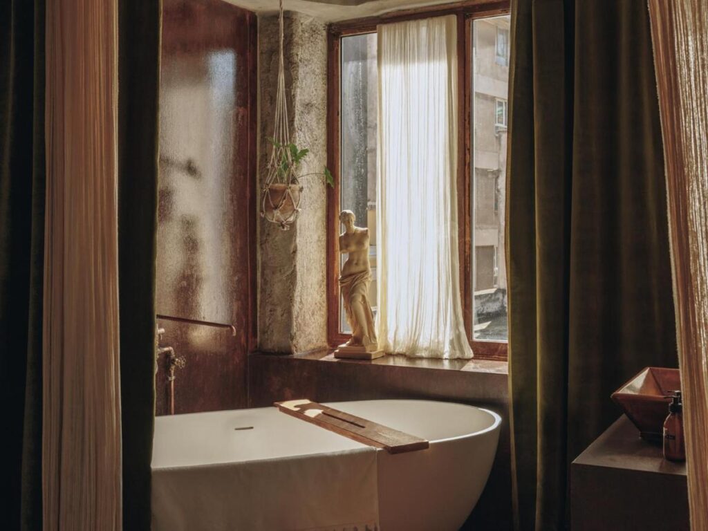 super elegant bathtub in room at the Mona Athens, one of the best boutique hotels in Athens, Greece