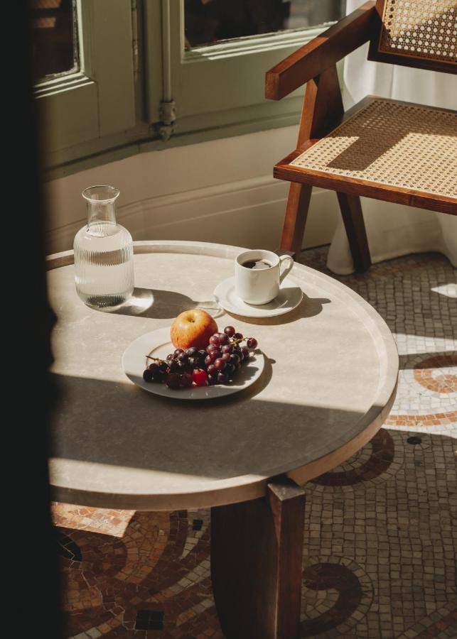 13 Unique Hotels in Barcelona, Spain 15 Coffee, fruit, and sunlight on table.