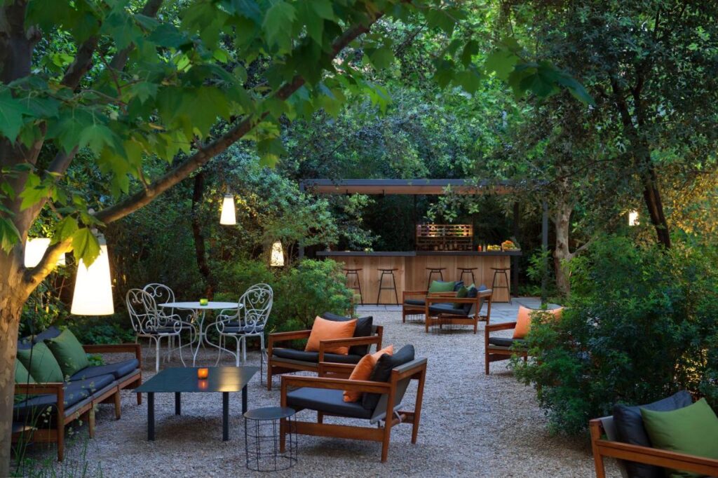 13 Unique Hotels in Barcelona, Spain 1 elegant garden at alma barcelona, one of the most unique hotels in Barcelona, spain