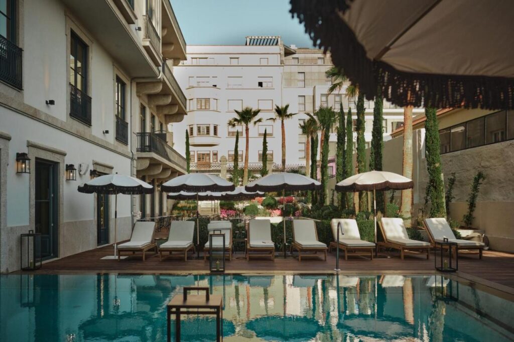 Top 12 Boutique Hotels in Porto, Portugal 6 garden and pool with sun loungers at ga palace, one of the best luxury boutique hotels in porto