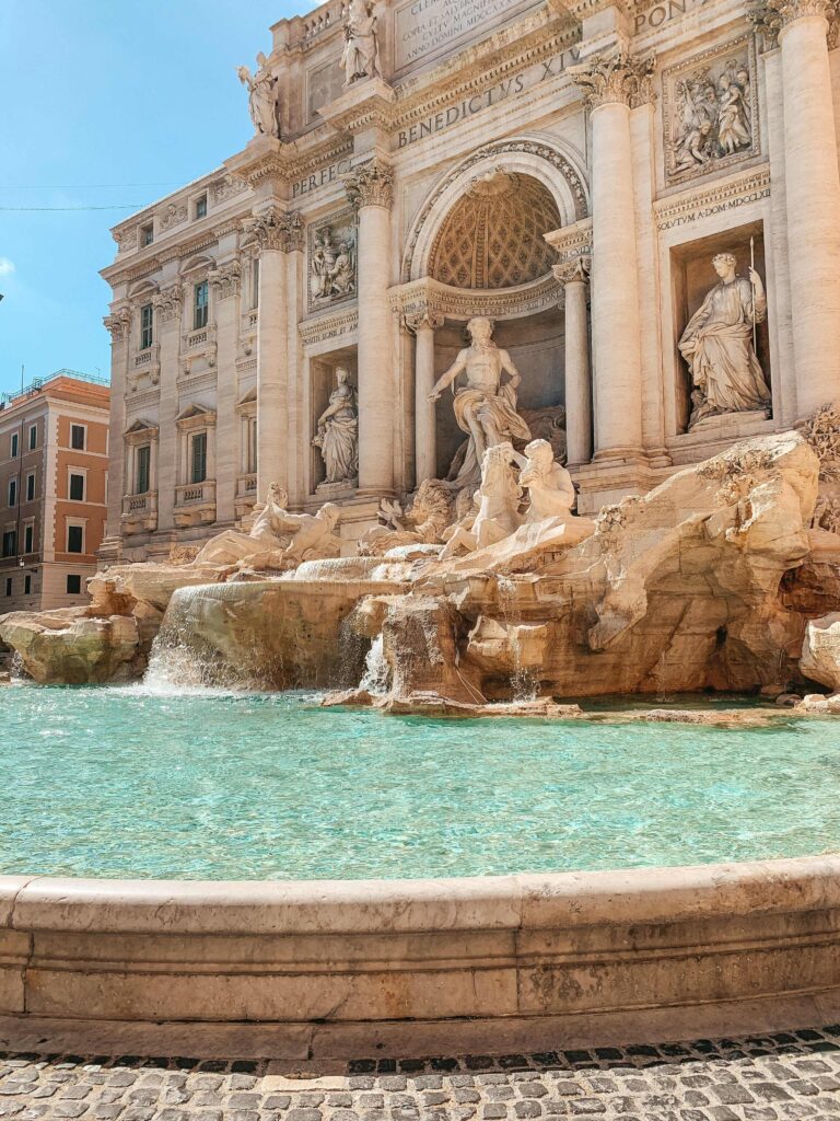 3 Days in Rome Itinerary 12 The image shows the Trevi Fountain in Rome, Italy, featuring ornate baroque sculptures and turquoise water—a must-see for guests staying at boutique hotels in Rome near this iconic historic landmark.