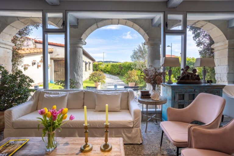 living room with nature view at casona las cinco calderas, one of the most unique hotels in cantabria spain