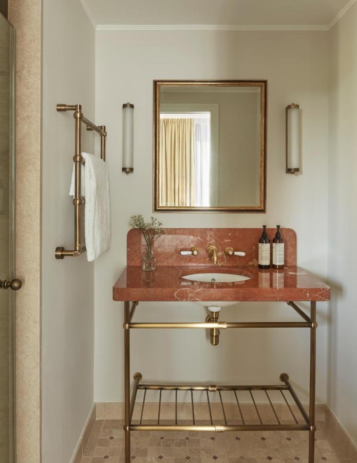 13 Unique Hotels in Barcelona, Spain 20 Elegant marble sink with gold accents