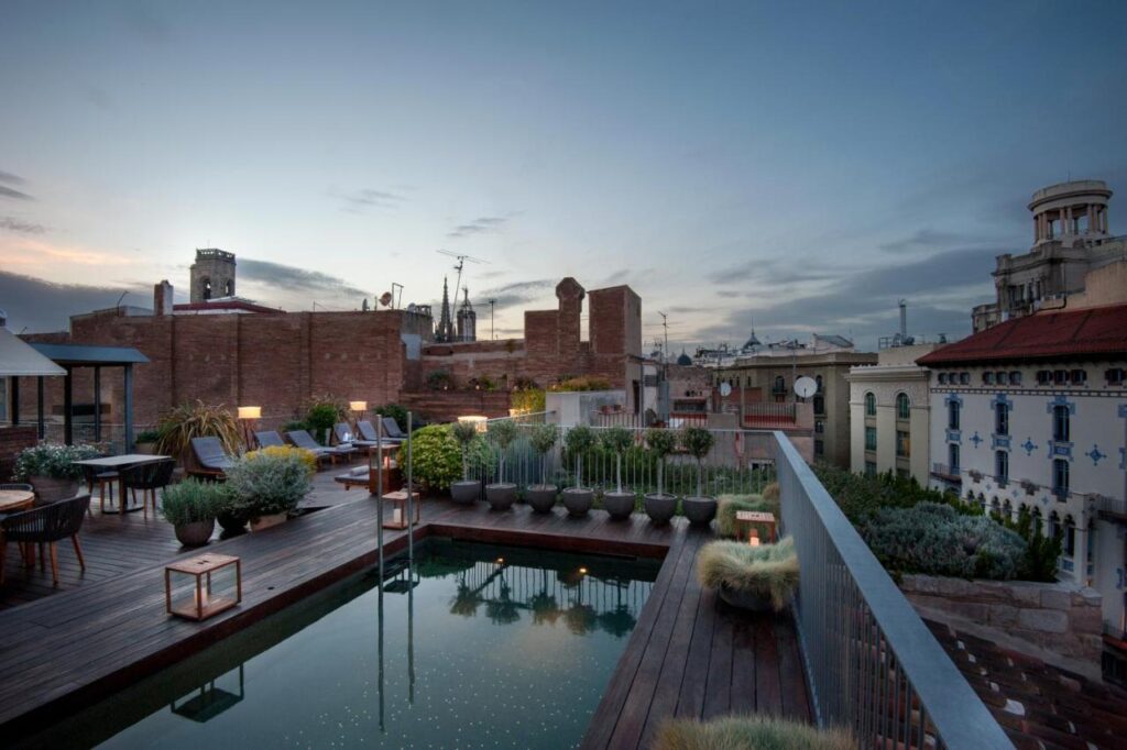 13 Unique Hotels in Barcelona, Spain 25 Luxurious rooftop pool at sunset.