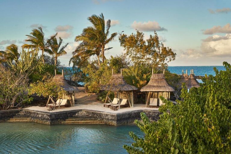 sun loungers in little cottages to sun bathe at paradise cove boutique adults only hotel in mauritius