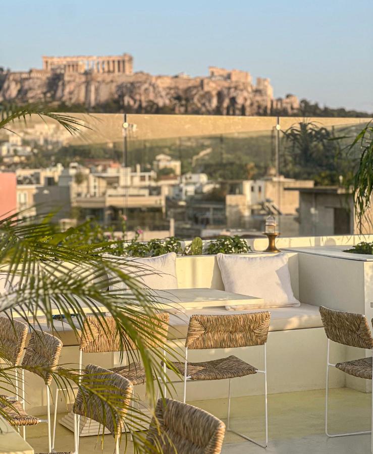 view of the acropolis from rooftop terrace at the apollo palm, one of the best boutique hotels in athens